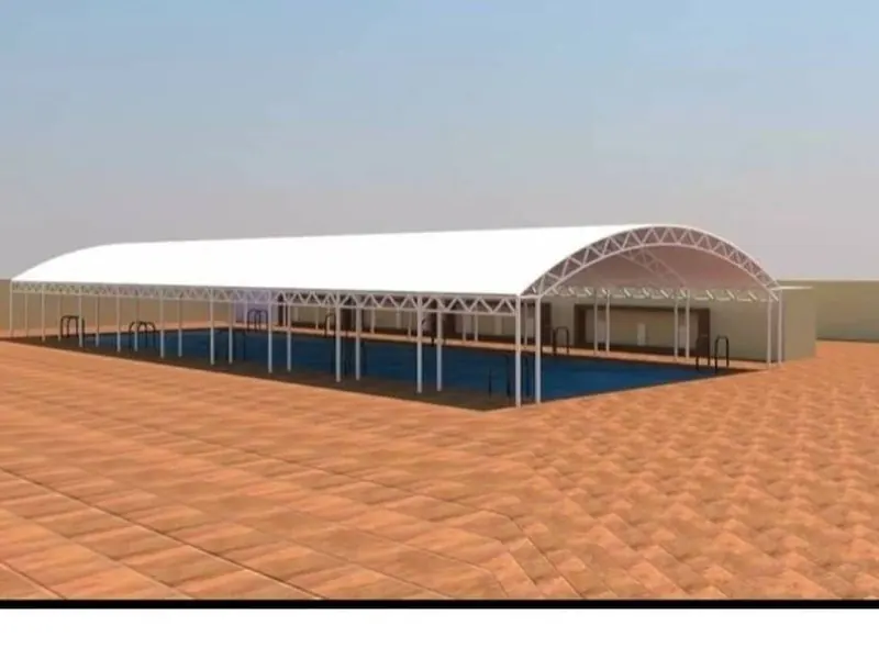 Clear-span arch roof over a pool — design