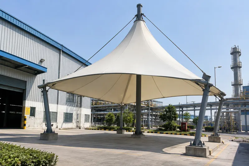 Single conical tensile canopy over an industrial loading area