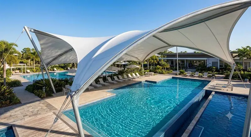 Hypar sail canopy over a resort pool