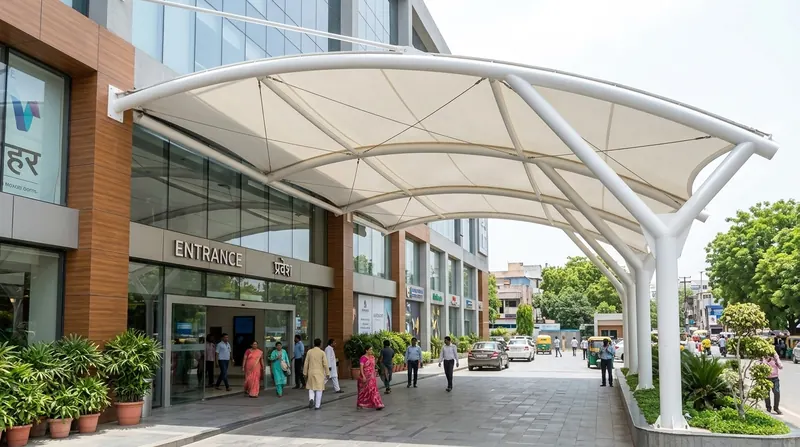 Curved tensile entrance canopy over a shopping-centre entrance